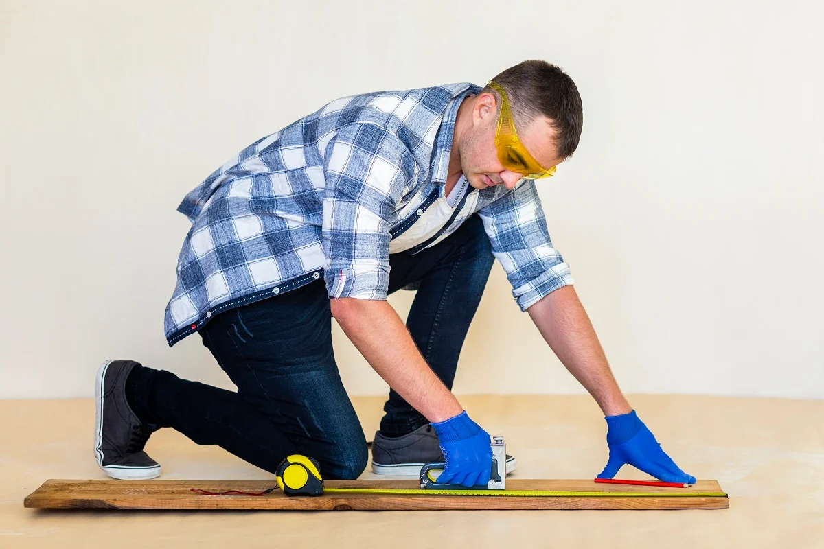 Carpenter measuring wood