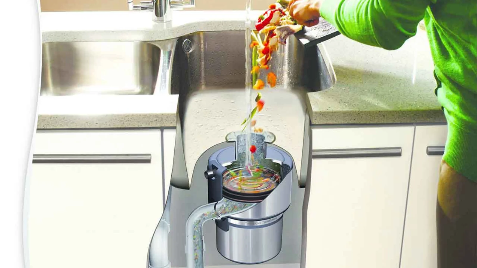 Person scraping food scraps into kitchen sink garbage disposal with cutaway view showing internal grinding chamber and flowing water.